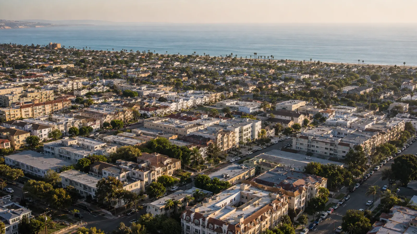 Split view of dense West Los Angeles apartment blocks and lower-rise beach city housing, the two housing patterns that drive different pest pressure